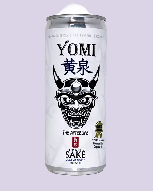 A single can of Yomi Craft Sake (The Afterlife) on a clean white background. The can is white with a black graphic of a Japanese Oni mask, black text, and a small red brand mark.