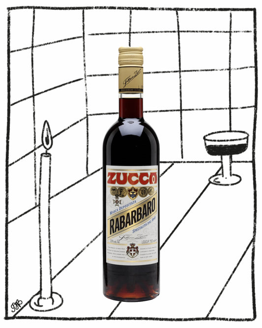 Bottle of Zucco Rabarbaro on a tiled floor with a candle and glass.